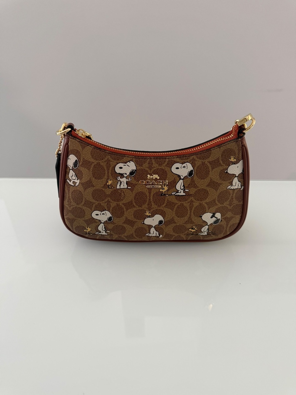 Coach Brown Signature Snoopy Mini Bag with Tan Trim and Gold Hardware